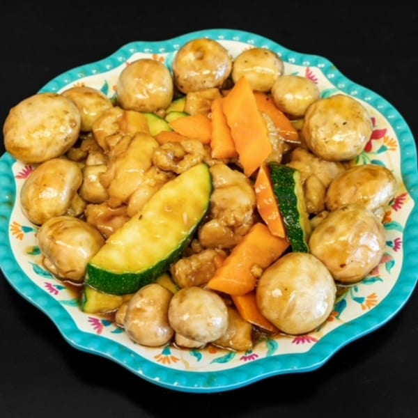 My City Chinese Foods' chicken with mushrooms, zucchini, and carrots in a savory sauce.