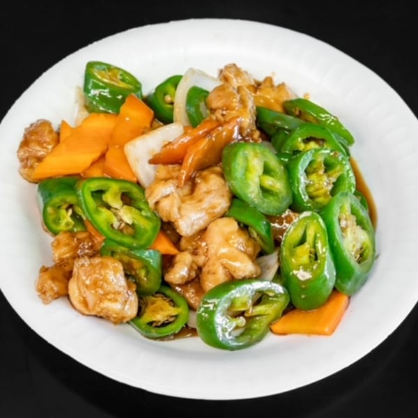 My City Chinese Foods' chicken stir-fry with green peppers, carrots, and onions on a white plate.